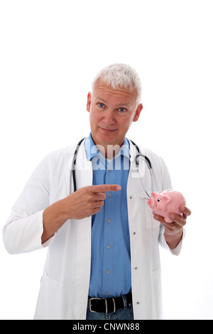 Senior Doctor pointiong an a piggy bank Stock Photo