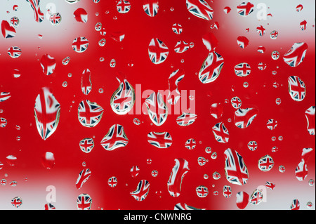 Union Jack flag reflected in raindrops on glass Stock Photo