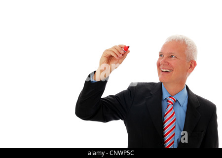 Businessman writing in air with red pen Stock Photo