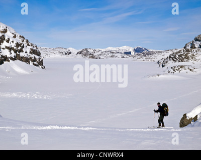 Male skier ski touring in Norway's Hardanger region Stock Photo