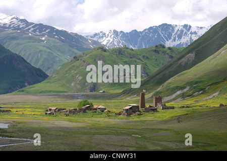 abandonned village and mediaeval fortress in front of mountain panorama, Georgia, Truso-Tal Stock Photo