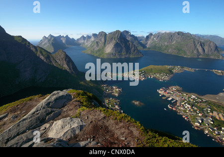 Reinefiord (Kjerkfiorden), view from Reinebringen with Reine and Olstinden, Norway, Lofoten Islands, Moskenesy Stock Photo