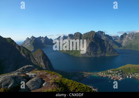 Reinefiord (Kjerkfiorden), view from Reinebringen with Reine and Olstinden, Norway, Lofoten Islands, Moskenes�y Stock Photo