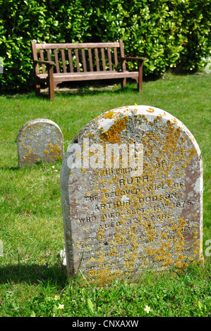 Ancient gravestones in churchyard, Holy Trinity Church, Upper Dicker, Arlington, East Sussex, England, United Kingdom Stock Photo