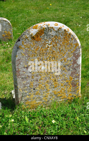 Ancient gravestones in churchyard, Holy Trinity Church, Upper Dicker, Arlington, East Sussex, England, United Kingdom Stock Photo