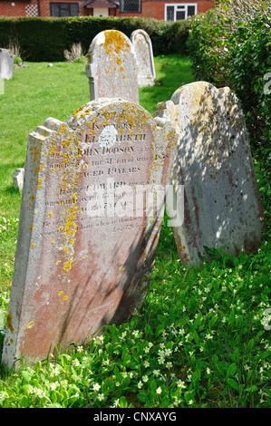 Ancient gravestones in churchyard, Holy Trinity Church, Upper Dicker, Arlington, East Sussex, England, United Kingdom Stock Photo