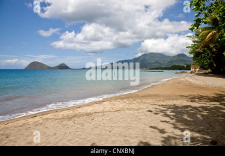 Beach at Picard near Portsmouth in Dominica looking across Prince Rupert Bay towards the twin hills of Cabrits National Park Stock Photo