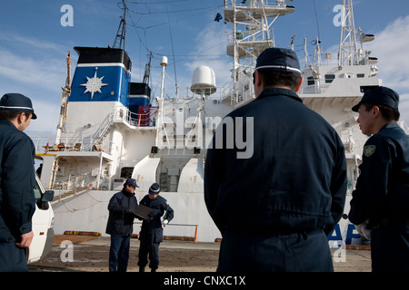 Japanese coast guard search underwater for the bodies of victims of the March2011 tsunami, in Kesennuma harbour, Tohoku, Japan. Stock Photo