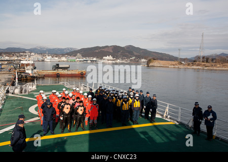 Japanese coast guard search underwater for the bodies of victims of the March2011 tsunami, in Kesennuma harbour, Tohoku, Japan. Stock Photo