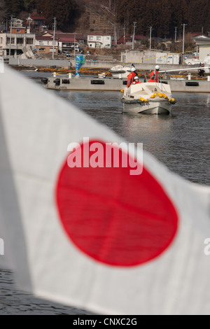 Japanese coast guard search underwater for the bodies of victims of the March2011 tsunami, in Kesennuma harbour, Tohoku, Japan. Stock Photo