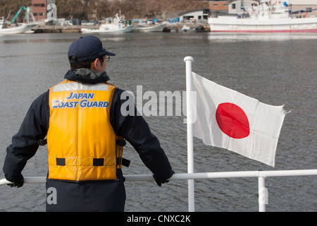 Japanese coast guard search underwater for the bodies of victims of the March2011 tsunami, in Kesennuma harbour, Tohoku, Japan. Stock Photo