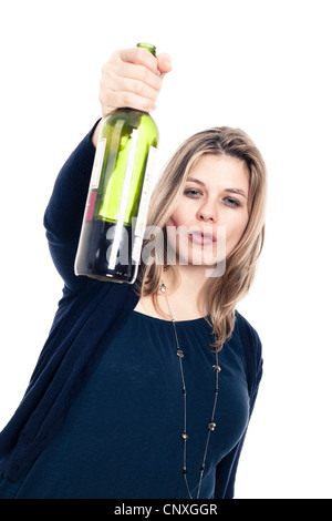 Young confident drunk woman holding bottle of wine, isolated on white background. Stock Photo