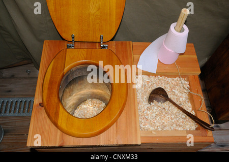 Ecological dry toilet with sawdust compost in lodge tent, Rhodes animal's park, Moselle, France, Europe Stock Photo