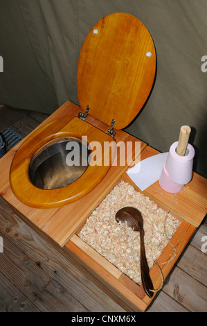 Ecological dry toilet with sawdust compost in lodge tent, Rhodes animal's park, Moselle, France, Europe Stock Photo