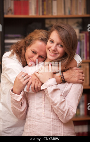Portrait of mother and daughter of teenager 15 years old, walking and