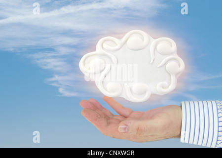 Hand holding a cloud computing concept on the blue sky Stock Photo