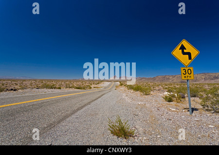 historical Route 66 with curvy road and speed limit signs, USA, Arizona Stock Photo