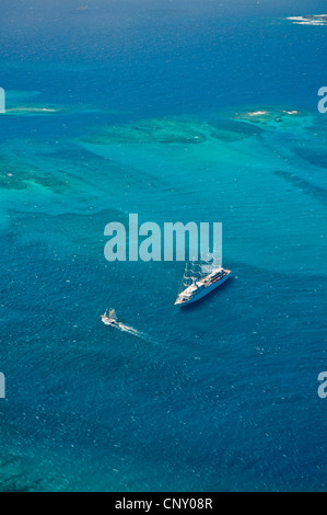 aerial view of a sailing ship and a boat on the Caribbean Sea between Tobago Cays and Mayreau Island, Saint Vincent and the Grenadines Stock Photo