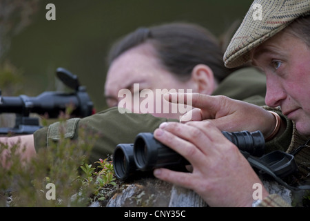 deer stalker and lady guest, United Kingdom, Scotland Stock Photo