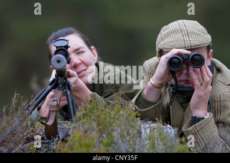 deer stalker and lady guest, United Kingdom, Scotland Stock Photo