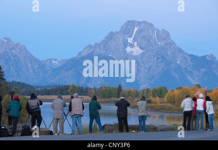 Photographers in front of Mount Moran at dawn, USA, Wyoming, Grand Teton NP Stock Photo