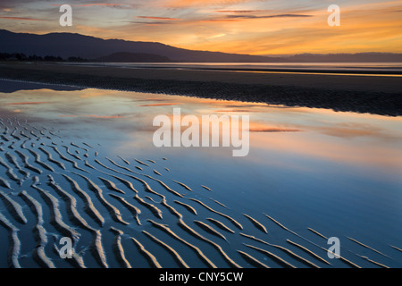 Ripples of sand on Pohara Beach at sunset, Golden Bay, South Island, New Zealand. Autumn (May) 2007 Stock Photo