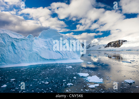Icebergs, brash ice and mountainous terrain on the Gerlache Strait, Antarctic Peninsula, Antarctica. December 2007 Stock Photo