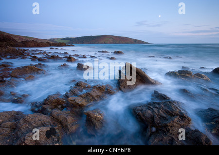 Incoming tide swirls around the rocky shores of Wembury Bay in South Devon, England Stock Photo