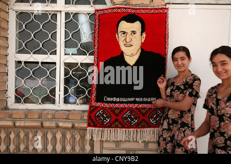 Carpet weaving workshop produced carpets with customers' photographs in Khiva, Uzbekistan. Stock Photo