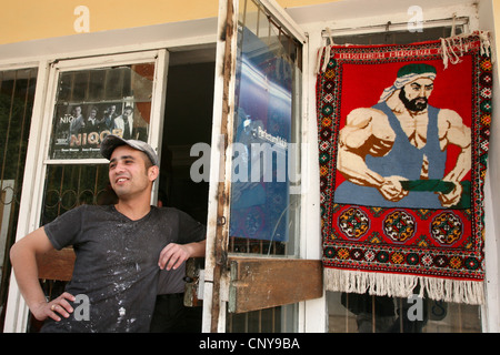 Carpet with a portrait of Uzbek national hero Pakhlavan Mahmud in Khiva, Uzbekistan. Stock Photo