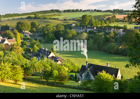 Cottages nestled into the valley in the picturesque Cotswolds village of Naunton, Gloucestershire, England. Summer (July) 2010. Stock Photo