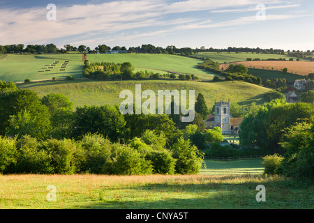 Naunton church surrounded by beautiful countryside in the picturesque Cotswolds, Gloucestershire, England. Summer (July) 2010. Stock Photo