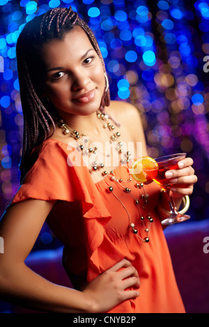 Beautiful African-American woman dressed with elegance enjoying herself at party Stock Photo