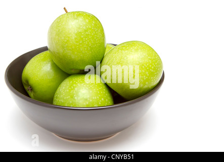 Black bowl of granny smith apples Stock Photo