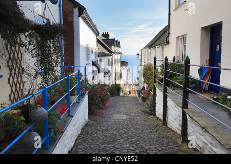 View to the sea down steep narrow cobbled street in quaint picturesque village of Clovelly, North Devon, England, UK. Stock Photo