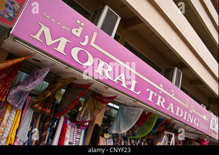 Indian textile shop sign in Dubai, United Arab Emirates 'Moral Trading'. Stock Photo