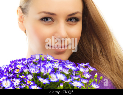 Beautiful female holding flowers, girl with bouquet of spring plant, bunch of purple cornflowers, lovely woman with gift Stock Photo