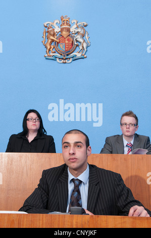 The Clerk of the Court sits in front of the Bench in a Magistrates' court Stock Photo