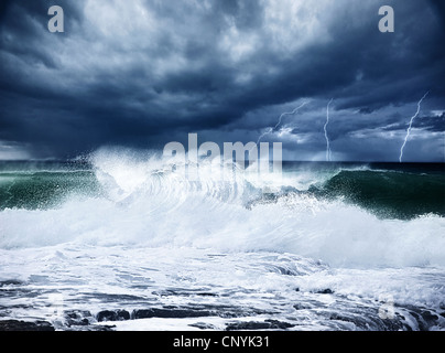 Thunderstorm and lightning on the beach, dark night scene with cloudy rainy stormy landscape, beautiful powerful forces Stock Photo