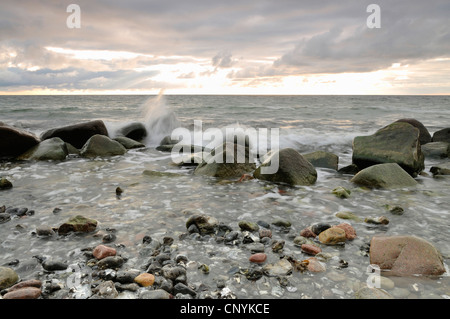 view at the sea over erratic boulders overflown by the surf, Germany, Mecklenburg Vorpommern Stock Photo