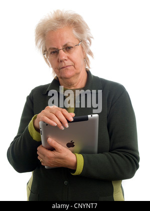 Mature woman holding iPad Stock Photo