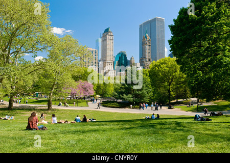 People relaxing in Central Park, New York City in spring season. Stock Photo