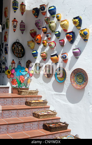 Mijas, Malaga, Costa del Sol, Andalucia, Spain. Coloured pottery for sale outside shop. Stock Photo