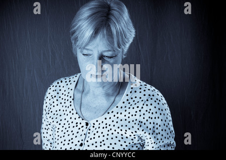 Portrait of middle aged woman looking away Stock Photo