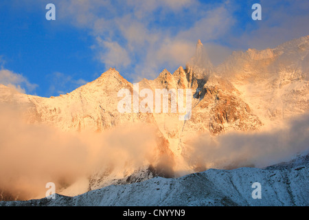 Aiguille de la Tsa (3668 m) with fog, Switzerland, Valais Stock Photo