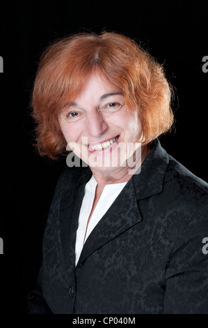 Middle aged woman with red hair looking happy Stock Photo