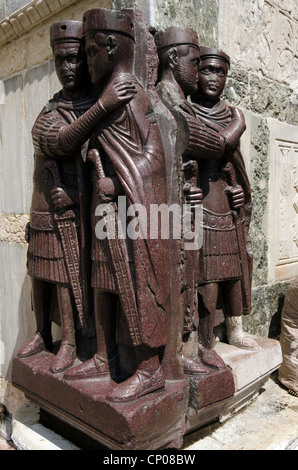 Sculpture of Four Tetrarchs near a gate in the Doge's Palace - sestiere San Marco, Venice - Italy The Portrait of the Four Tetrarchs is a sculpture group of four Roman emperors, wedged into a corner on the facade. Stock Photo