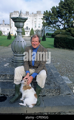 Desmond FitzGerald, 29th Knight of Glin, with Jack, in the garden of his ancestral home, Glin Castle, Co. Limerick Stock Photo