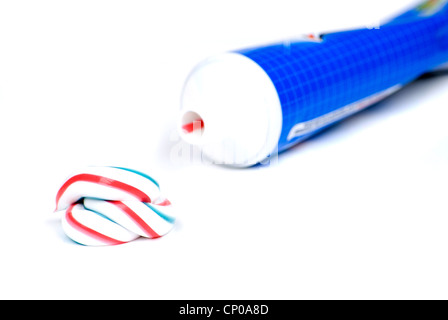 white red and blue squeezed toothpaste isolated on a white background ...