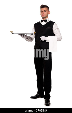 A young boy waiter with a tray. Isolated background and clipping path Stock Photo